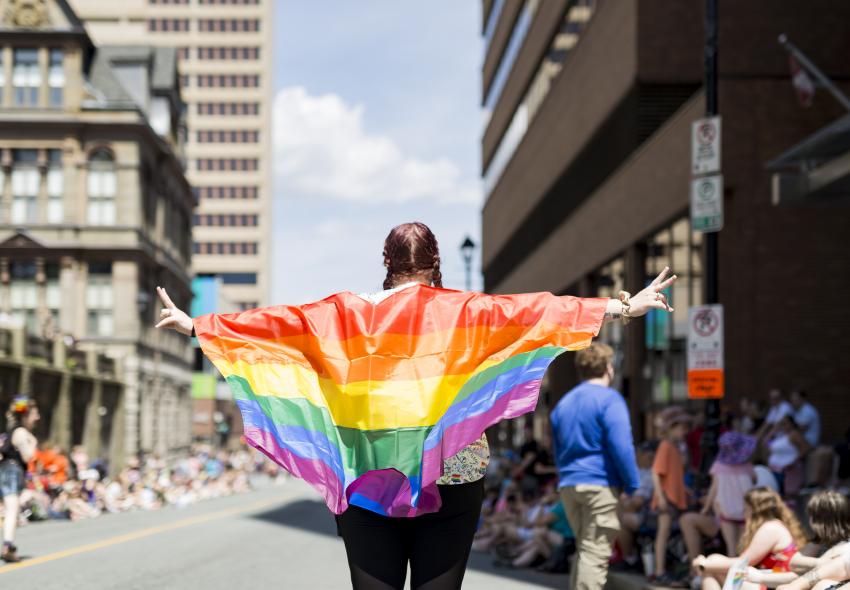 A women with a pride flag 