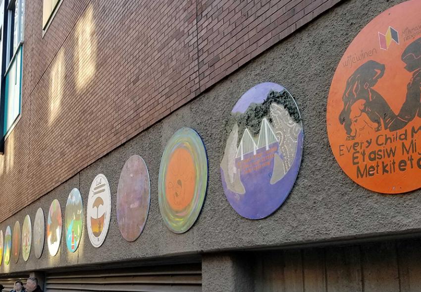 Closer shot of the murals hanging on the exterior wall of Scotia Square facing Barrington Street