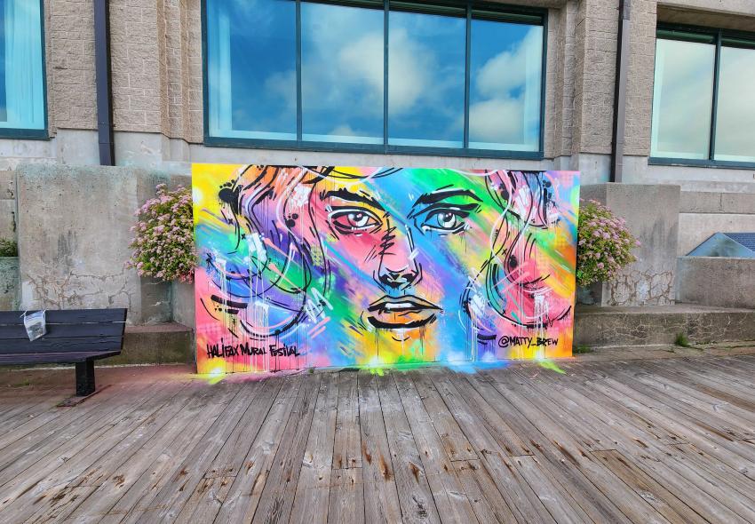 Colourful mural by Matty Brew on a Halifax Marriott Harbourfront wall