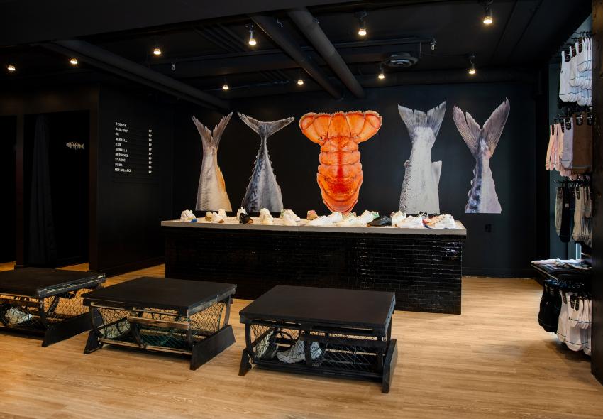Wide shot of Market Price's interior, including their fish tail mural, shoe display, and more