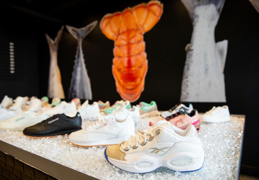 Market Price's shoe display with their cool fish tail mural in the background