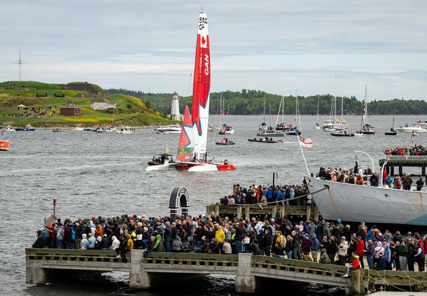 Crowds along the Halifax Waterfront watch team Canada's boat sail in the Halifax Harbour in Downtown Halifax. 
