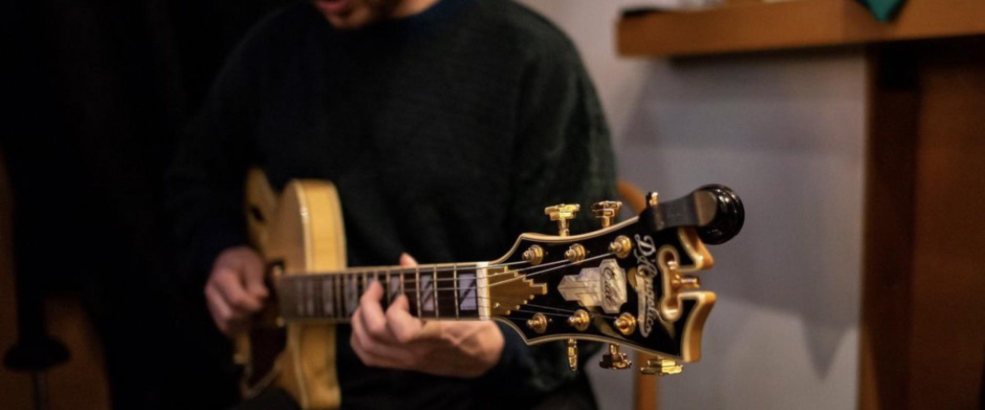 Gabe Mink playing guitar.