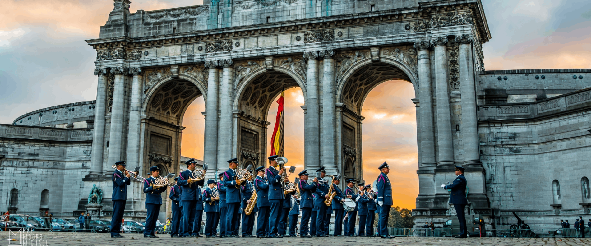 The Royal Band of the Belgian Air Force perform in front of a three arched monument in Parc du Cinquantenaire in Brussels, Belgium.
