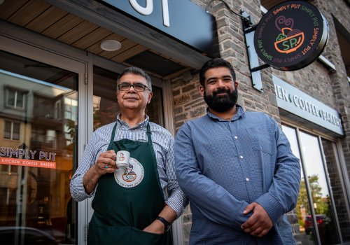 Tahla and Tahir, co-owners of Simply Put in front of their store