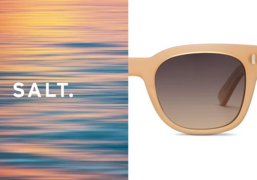 Gently moving water with colors of a sunset with the Salt Logo on the left. Half of a pair of beige sunglasses on the right on a white background.