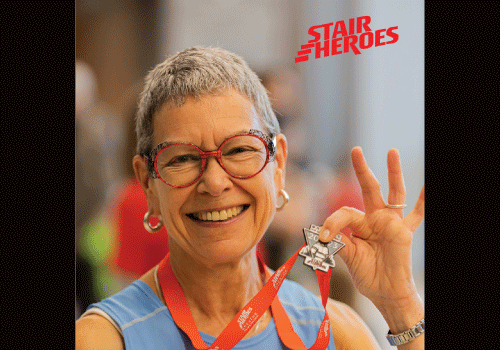 Stair Heroes participant holding medal