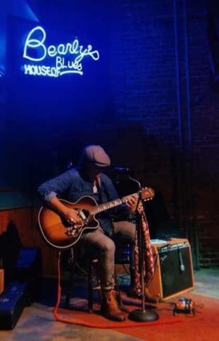 man playing guitar
